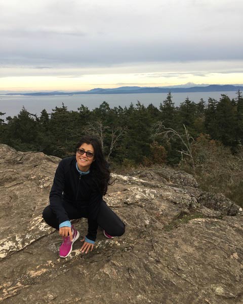 Dr Preet Sehmi running on a trail in Victoria BC